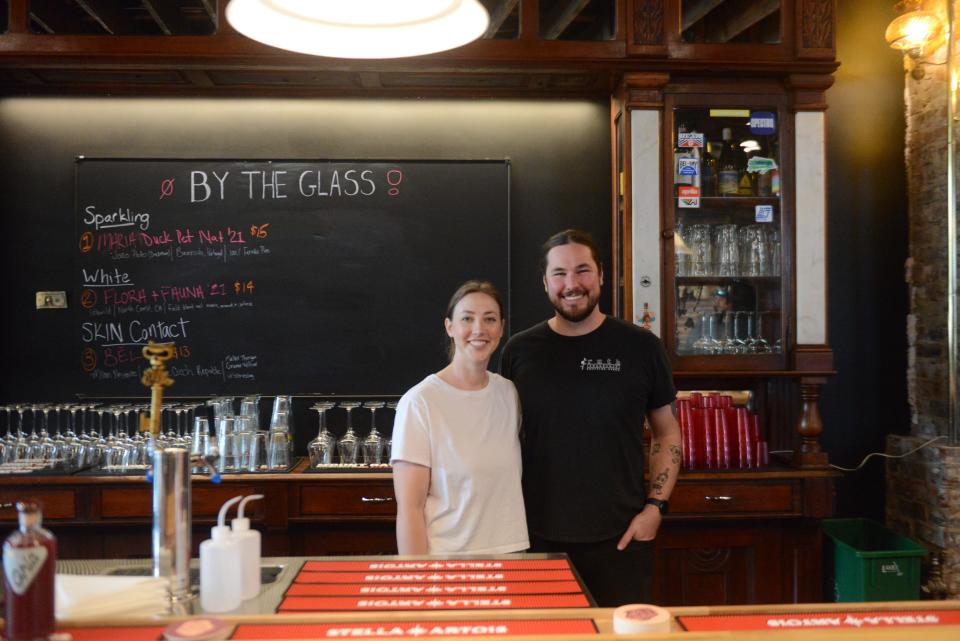 Owners Alexis and Zach Hill posing behind the bar at Zero/Zero, a natural wine bar opening on June 9 in Happy Holler. May 31, 2023.