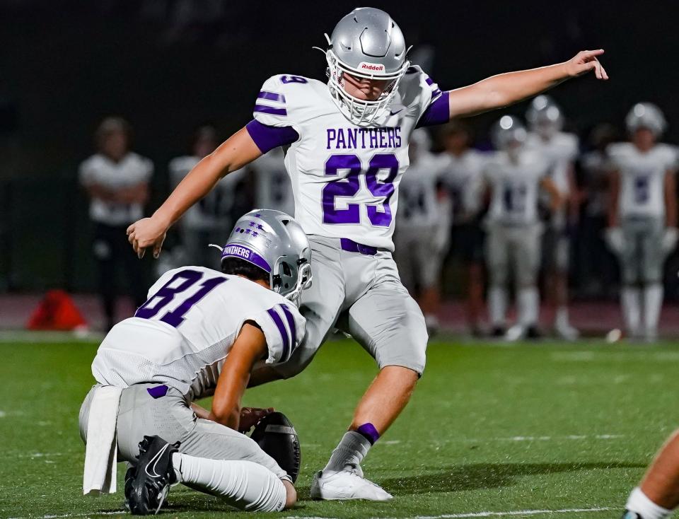 Bloomington South’s Bryce Taylor (89) makes a 41-yard field goal from the hold of Noah Hernandez (81) during the IHSAA sectional semi-final football game at Bloomington North on Friday, Oct. 27, 2023.