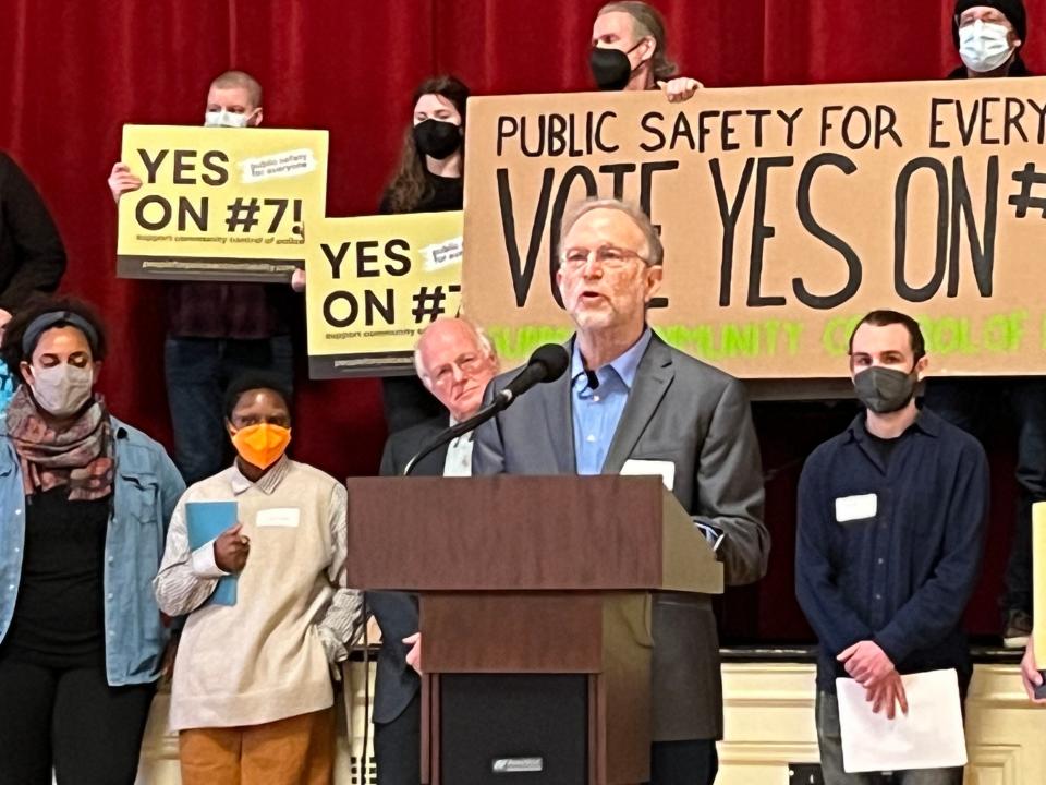 Jerry Greenfield speaks in support of the community control board on Feb. 22, 2023 while Ben Cohen looks on from behind. Ben & Jerry's the company also supports the Burlington ballot item.