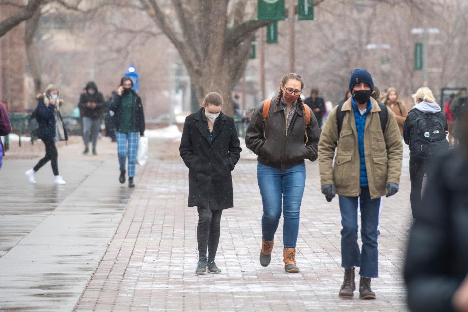 Colorado State University students make their way through campus on Wednesday, Jan. 19, 2022.