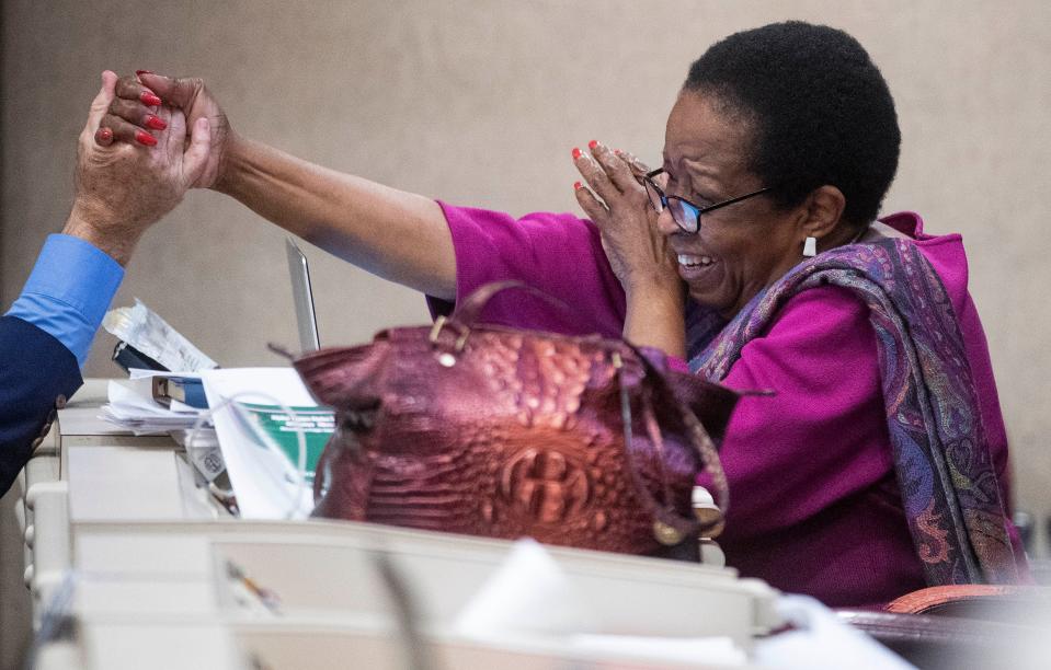 Rep. Laura Hall is congratulated after the Medical Cannabis bill is amended to be named after her son during debate in the house chamber at the Alabama Statehouse in Montgomery, Ala., on Thursday May 6, 2021.