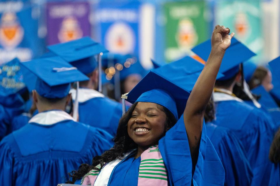 Chemani Linton, of Paterson, a social behavioral science major, waving to her family at the 2024 Seton Hall Commencement at the Prudential Center in Newark, NJ on Tuesday May 21, 2024.