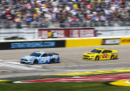 Kevin Harvick (4) and Joey Logano (22) drive during a NASCAR Cup Series auto race at the Las Vegas Motor Speedway on Sunday, Feb. 23, 2020. (AP Photo/Chase Stevens)