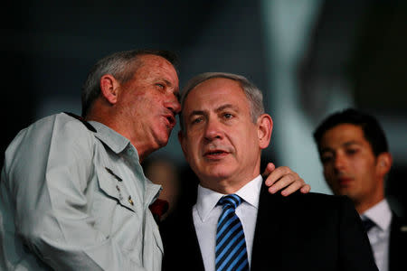 FILE PHOTO: Israel's Prime Minister Benjamin Netanyahu (R) and Israel's armed forces chief Major-General Benny Gantz speak during the opening ceremony of the 19th Maccabiah Games at Teddy Stadium in Jerusalem July 18, 2013. REUTERS/Baz Ratner/File Photo