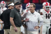 FILE - Georgia head coach Kirby Smart speaks with Alabama head coach Nick Saban before the first half of the Southeastern Conference championship NCAA college football game, Saturday, Dec. 4, 2021, in Atlanta. Georgia plays Alabama in the College Football Playoff national championship game on Jan. 10, 2022. (AP Photo/Brynn Anderson, File)