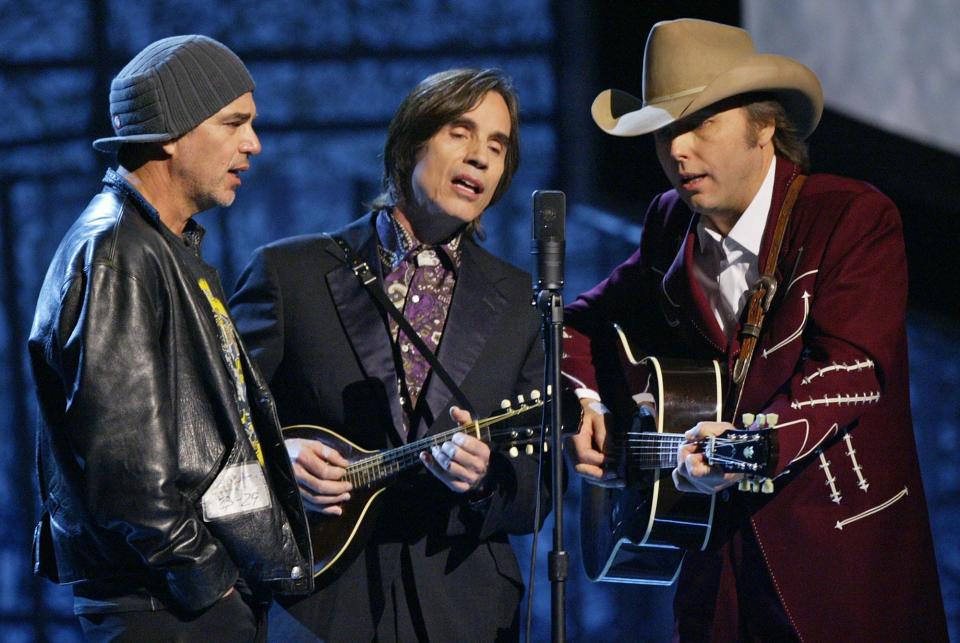 From right: Dwight Yoakam, Jackson Browne and Billy Bob Thornton perform "Keep Me in Your Heart" in tribute to the late Warren Zevon during the 46th annual Grammy Awards in 2004.