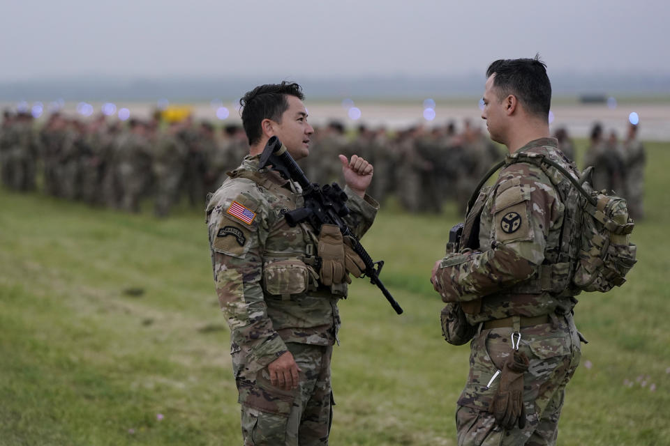 Members of the Texas National Guard prepare to deploy to the Texas-Mexico border in Austin, Texas, Monday, May 8, 2023. The Title 42 policy, a federal rule that has allowed the government to strictly regulate border entries, is set to expire this week. (AP Photo/Eric Gay)