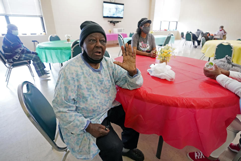 P.M. Browner, 88, speaks about her apprehension over receiving the COVID-19 vaccine, while waiting for a transportation bus at the Rev. S.L.A. Jones Activity Center for the Elderly to take her to receive a vaccination, Wednesday, April 7, 2021, in Clarksdale, Miss. She said she thinks vaccinations will eventually be required, and she wants to be able to continue to socialize at a local senior center. (AP Photo/Rogelio V. Solis)