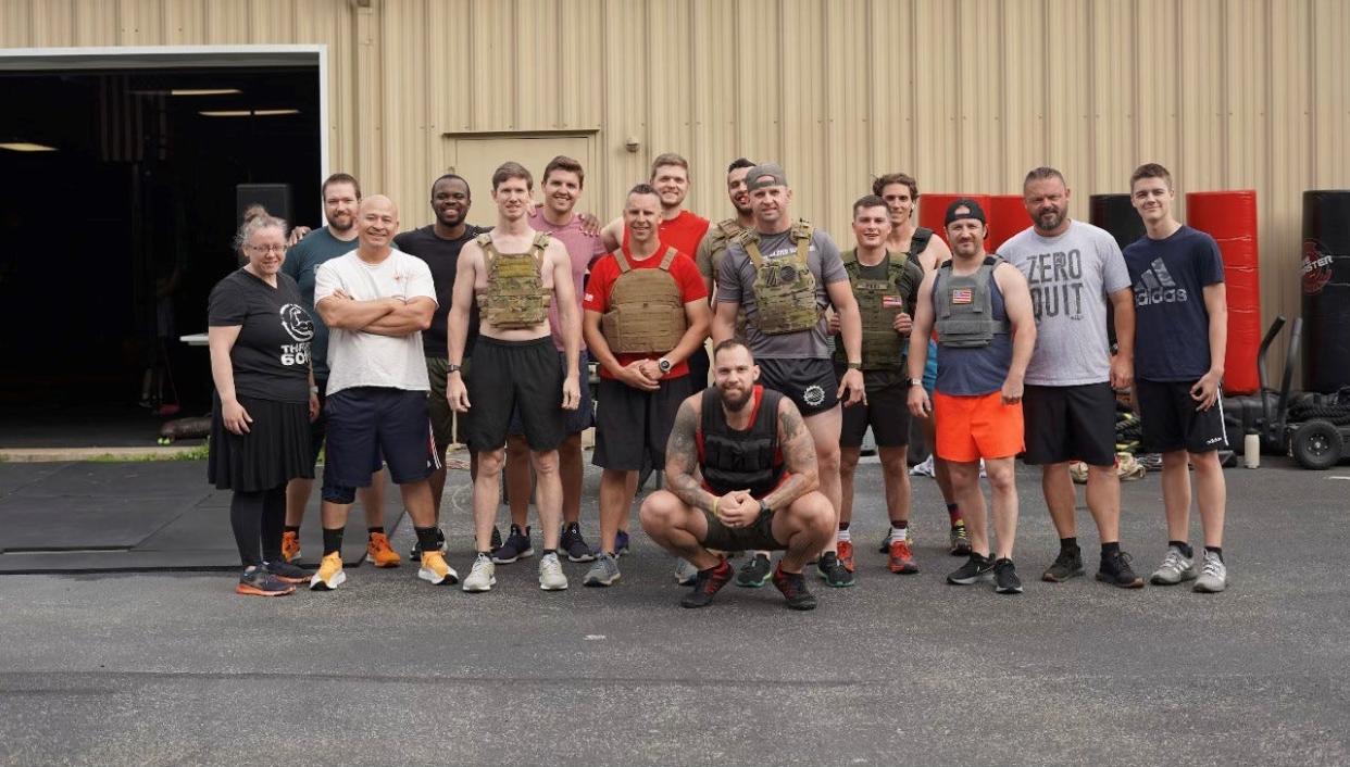 Christian Koshaba, in front, who owns Three60fit fitness center, is shown with some other veterans on May 28, 2022, when they competed in the Murph Challenge, which involves running a mile and doing several hundred pushups, situps and other exercises.