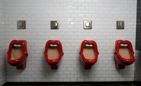 Urinals inspired by the Rolling Stones lips and tongue logo are seen in a bar in Paris, October 15, 2015. REUTERS/Jacky Naegelen