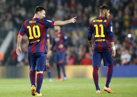 Barcelona's Lionel Messi (L) celebrates his goal next to Neymar during their Spanish first division soccer match against Sevilla at Nou Camp stadium in Barcelona November 22, 2014. REUTERS/Gustau Nacarino