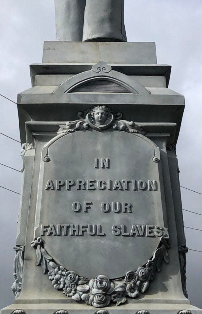 A monument at the Tyrrell County Courthouse in North Carolina has drawn controversy for its inscription reading, 'In appreciation of our faithful slaves.' Lt. Col. William F. Beasley gifted the monument in 1902.