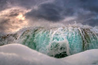 <p>A crashing wave thunders towards photographer, Marco Mitre as he fearlessly holds his ground and photographs the incoming wave during stormy conditions in Oahu. (Photo: Marco Mitre/Caters News) </p>