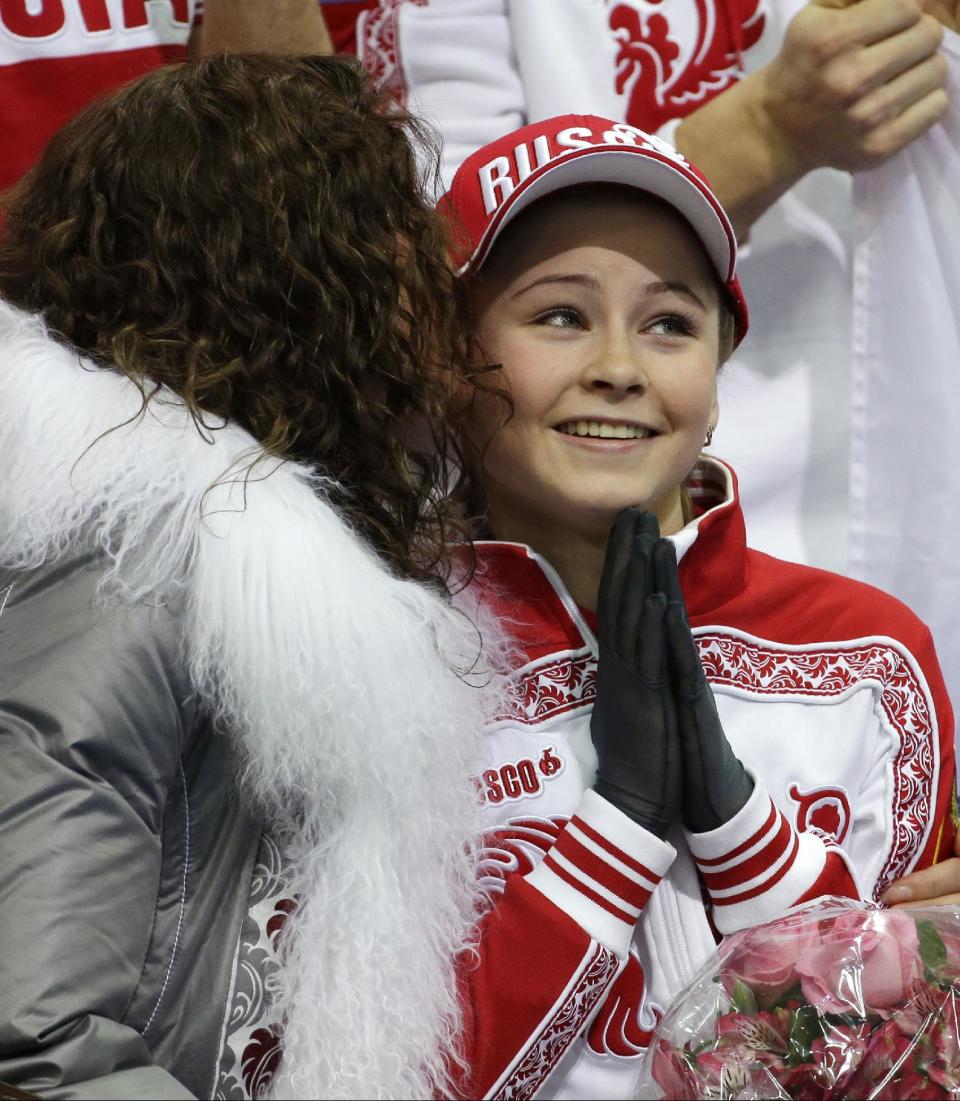 Julia Lipnitskaia of Russia sits in the results area after competing in the women's team free skate figure skating competition at the Iceberg Skating Palace during the 2014 Winter Olympics, Sunday, Feb. 9, 2014, in Sochi, Russia. (AP Photo/David J. Phillip )