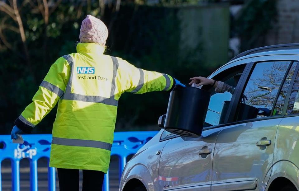 A member of NHS Test and Trace collects a sample from a member of the public at the drive-thru Covid-19 testing site on Hawkwood Road in Bournemouth (Andrew Matthews/PA) (PA Wire)