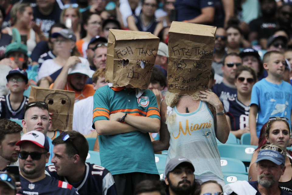 Unhappy Miami Dolphins fans are already wearing paper bags to show their frustration with the team. (AP)