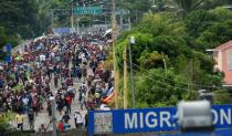 Honduran migrants taking part in a caravan heading to the US arrive at a border crossing point with Mexico in Ciudad Tecun Uman, Guatemala on October 19, 2018
