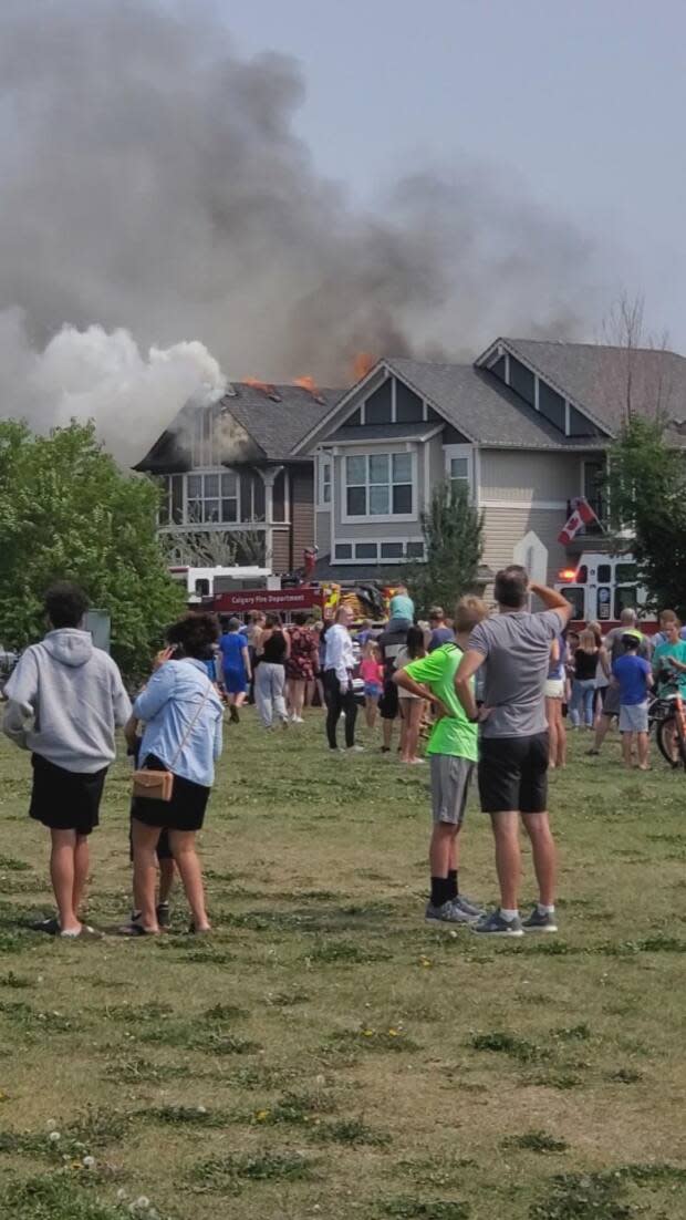 A two alarm house fire in southeast Calgary displaced seven residents from their homes. (Tracey McKeen Photography - image credit)