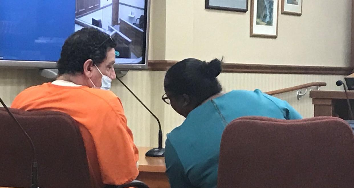 Anthony Gonzalez of Sturgeon Bay confers with his attorney, Aileen Henry, during a preliminary hearing May 24 in Door County Circuit Court. Gonzalez faces two second-degree reckless homicide charges and six other charges resulting from a Feb. 22 fire at Butch's Bar in Sturgeon Bay.