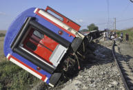 <p>An overturned train car is seen near a village at Tekirdag province, Turkey, July 8, 2018. (Photo: Mehmet Yirun/DHA-Depo Photos via AP) </p>