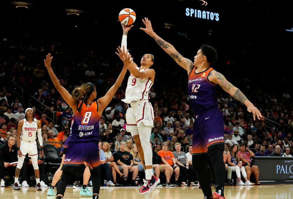 Washington Mystics guard Natasha Cloud (9) takes a shot against Phoenix Mercury guard Moriah Jefferson (8) in the second half at Footprint Center in Phoenix on Aug. 8, 2023.