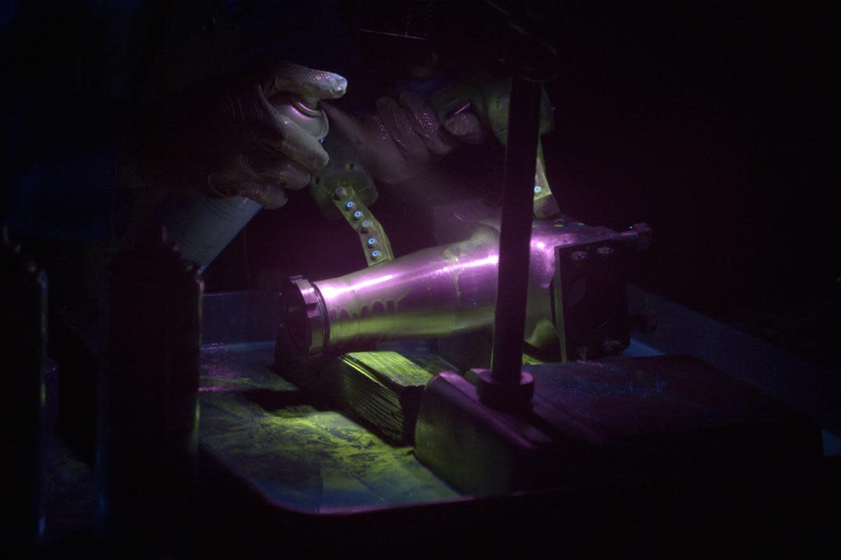 Crack testing with Ultra-Violet fluorescent light <i>(Image: Beaulieu Enterprises)</i>