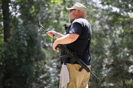 Greg Holland, a member of Open Carry Texas, openly carries a firearm in Houston, Texas, U.S., September 24, 2018. Picture taken September 24, 2018. REUTERS/Loren Elliott