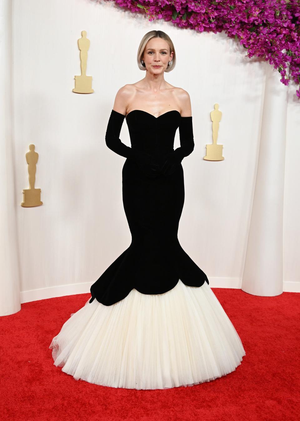 Image may contain: Carey Mulligan, Fashion, Clothing, Dress, Adult, Person, Wedding, Premiere, Red Carpet, and Formal Wear