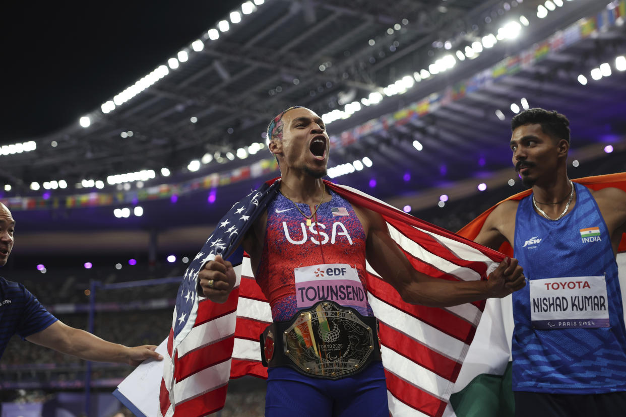 Roderick Townsend celebrates after winning in the T47 Men's High Jump at the 2024 Paralympics, Sunday, Sept. 1, 2024 in Paris, France. (AP Photo/Caleb Craig)