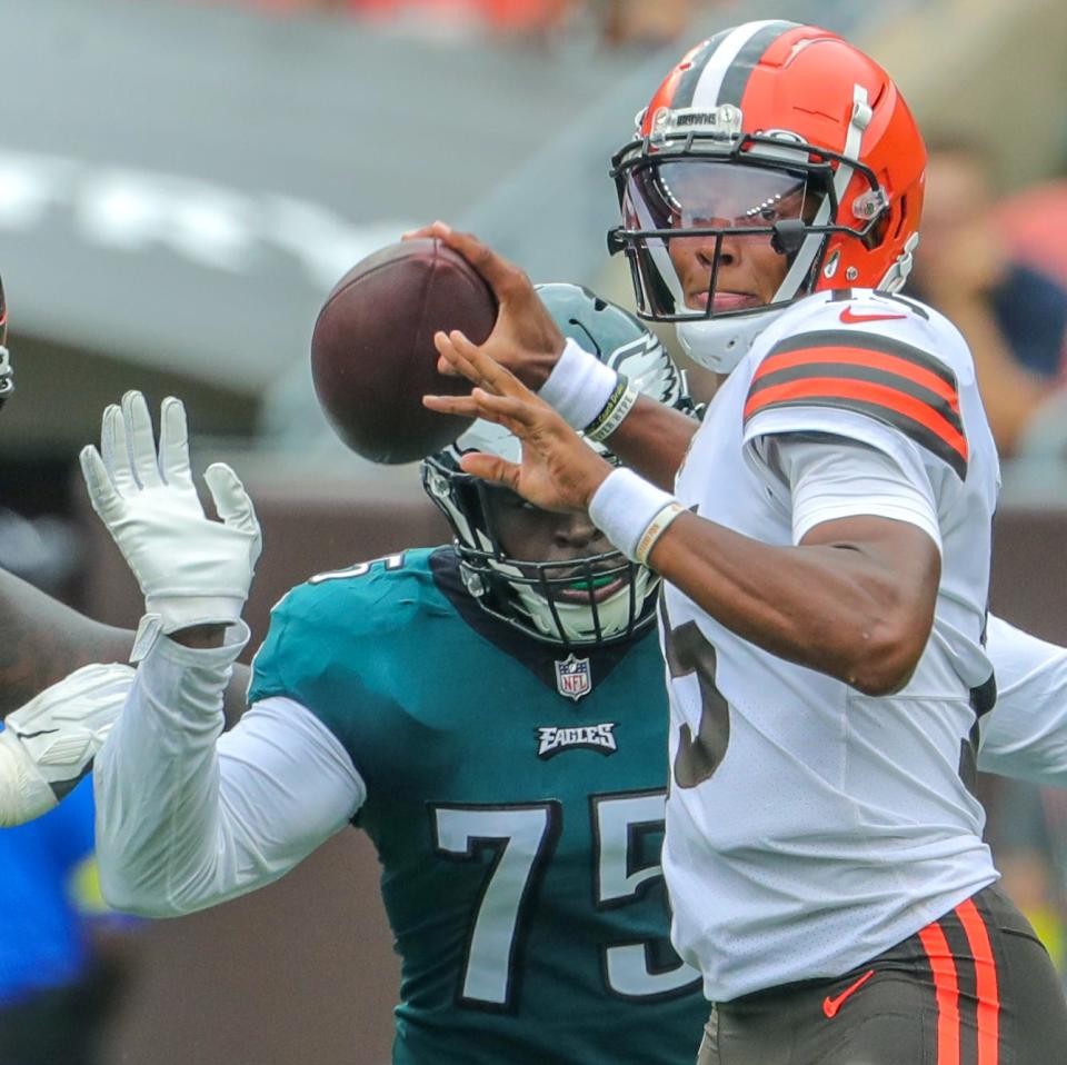 Cleveland Browns quarterback Josh Dobbs gets off a first quarter pass as Philadelphia Eagles' Tarron Jackson closes in on Sunday, Aug. 21, 2022 in Cleveland, Ohio, at FirstEnergy Stadium.