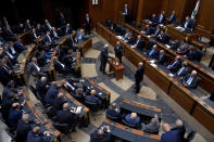 Lebanese lawmakers cast their vote to elect a president at the parliament building in downtown Beirut, Lebanon, Thursday, Sept. 29, 2022. Lebanon's Parliament on Thursday failed to elect a new president with the majority of lawmakers casting blank ballots. (AP Photo/Bilal Hussein)