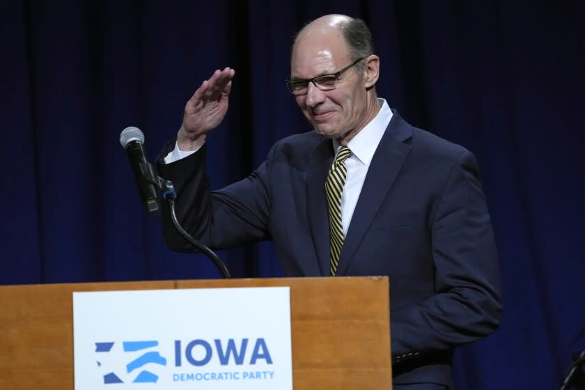 FILE - Retired Navy Admiral Mike Franken salutes before speaking at the Iowa Democratic Party's Liberty and Justice Celebration, on April 30, 2022, in Des Moines, Iowa. (AP Photo/Charlie Neibergall, File)