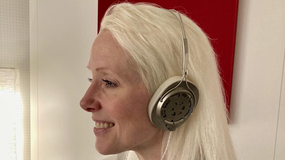 Fianl prototype headphones worn by a woman at High End Munich