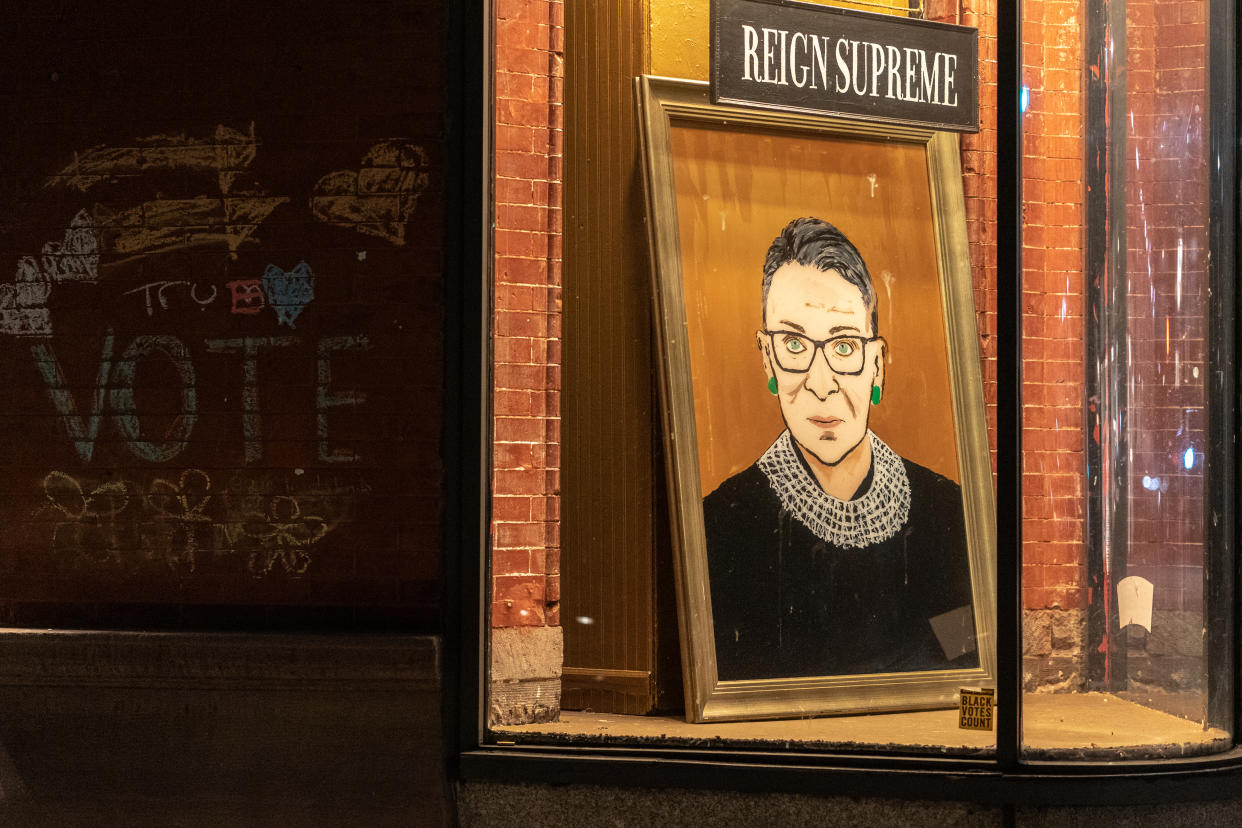 People are dedicating art, baked goods and tattoos to Ruth Bader Ginsburg across the country this weekend. The Supreme Court justice died at age 87 after a battle with pancreatic cancer. (Photo: Jeenah Moon/Getty Images)