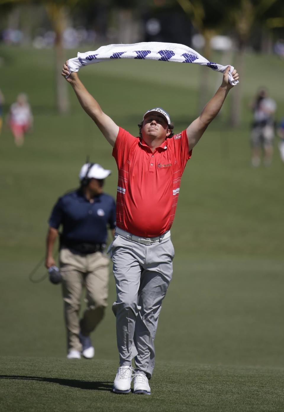 Jason Dufner walks up to the fourth hole during the second round of the Cadillac Championship golf tournament Friday, March 7, 2014, in Doral, Fla. (AP Photo/Lynne Sladky)