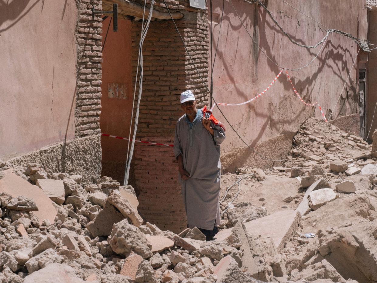 A man inspects damage caused by the earthquake as he walks in the old Medina of Marrakech (Copyright 2023 The Associated Press. All rights reserved.)