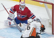 Anaheim Ducks' Simon Benoit shoots against Montreal Canadiens goaltender Cayden Primeau during first-period NHL hockey game action in Montreal, Thursday, Jan. 27, 2022. (Graham Hughes/The Canadian Press via AP)