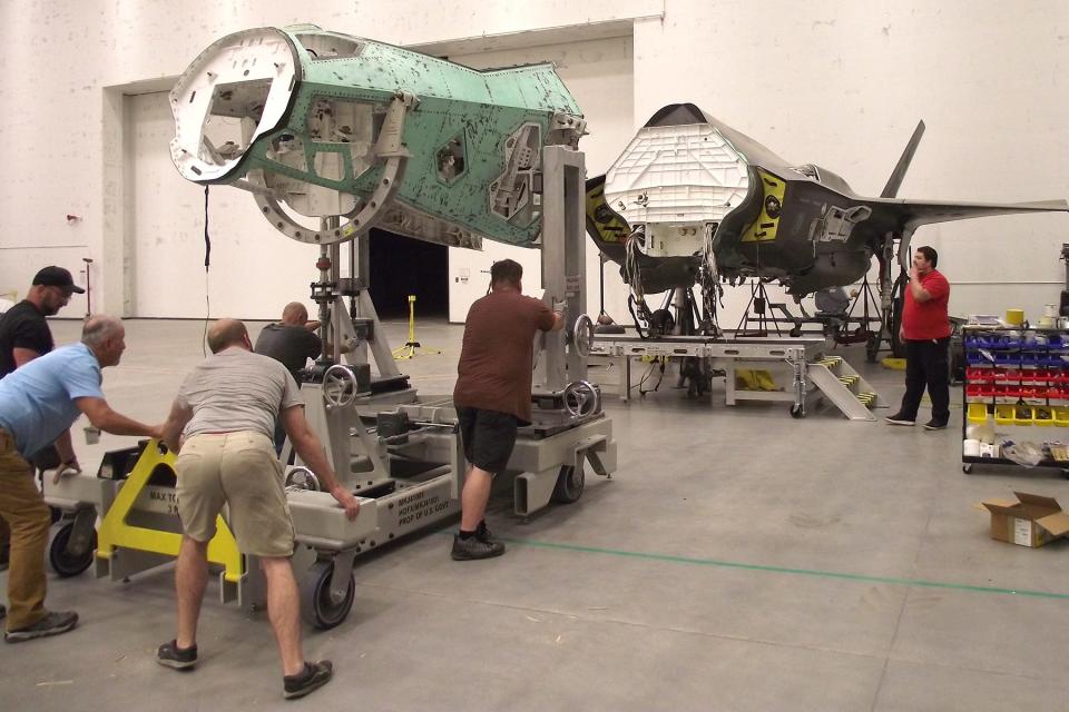 Engineers move parts of the F-35 using specially designed fixtures and tools.