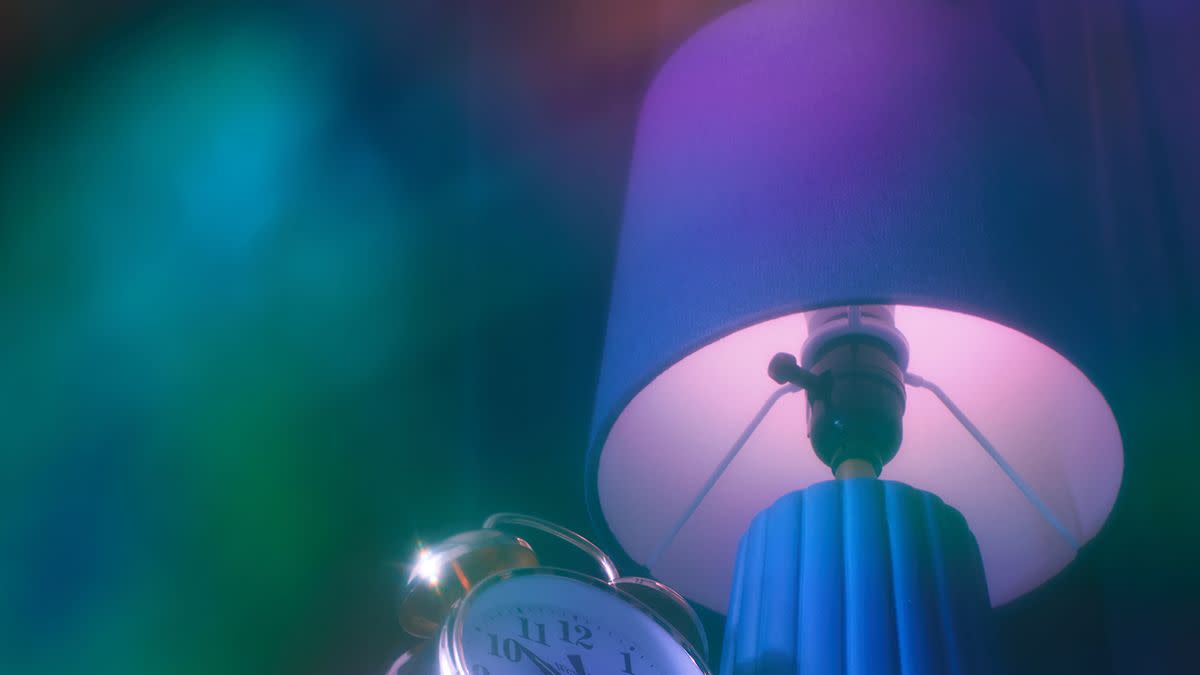 a clock and a lamp in a dreamy setting