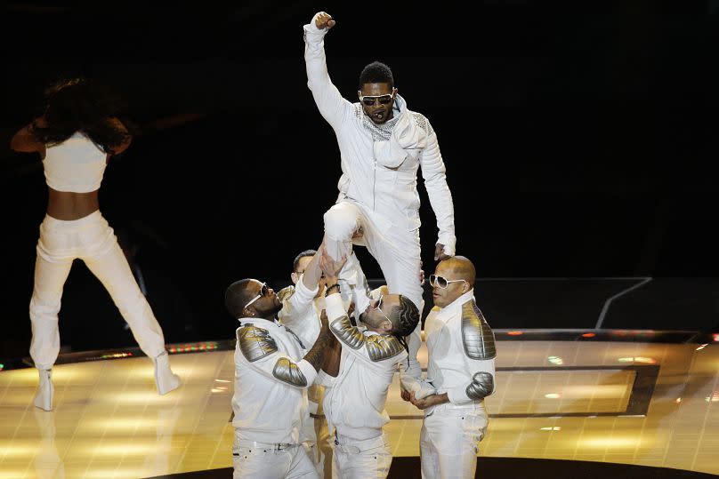 Usher perfomrs during halftime at the NFL Super Bowl XLV football game Sunday, Feb. 6, 2011, in Arlington, Texas.