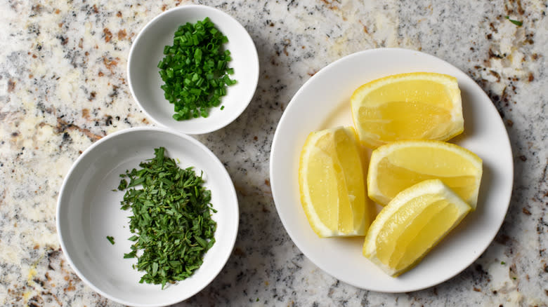 garden herbs and lemon wedges