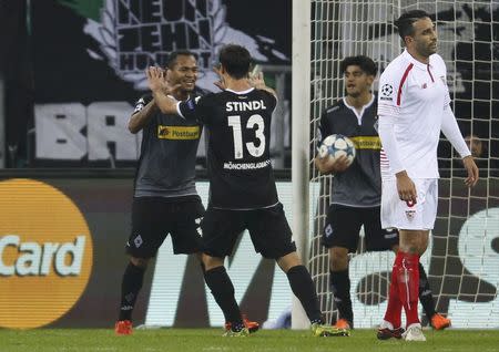 Football Soccer - Borussia Moenchengladbach v Sevilla - UEFA Champions League Group Stage - Group D - Borussia-Park, Moenchengladbach, Germany - 25/11/15 Borussia Moenchengladbach's Raffael celebrates third goal against Sevilla with Lars Stindl REUTERS/Ina Fassbender