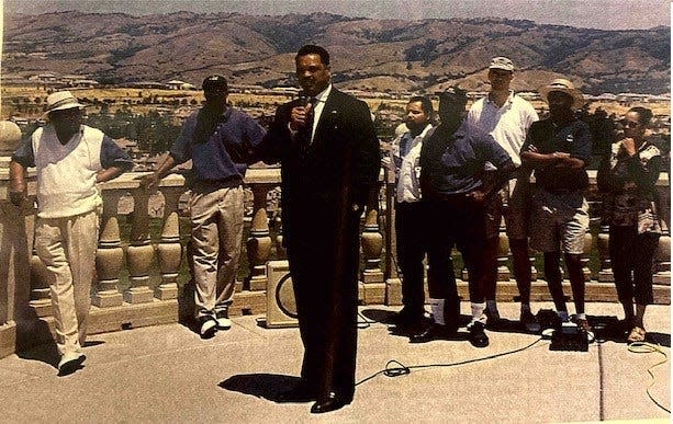 Roy with golf tournament committee members at first annual Virginia Clay Unity Care Group Charity Golf Tournament in the early 2000’s. Back row L-R (Roy Clay, Chris Clay, Cedric Martin, Andre Chapman, Mike Stipe, Carl Agers, Jet Chapman). Front, speaking, Jesse Jackson. 