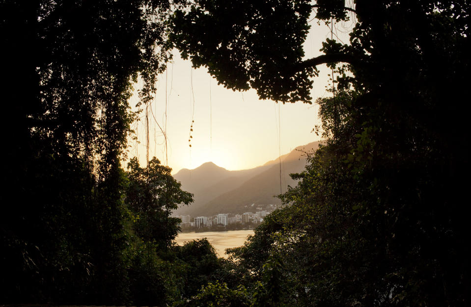 In this Sept. 15, 2012 photo, the Lagoa Rodrigo de Freitas lagoon is seen from the Quilombo Sacopa in Rio de Janeiro, Brazil. The Pinto family first arrived more than a century ago as escaped slaves hiding out in a nearby cave. Since then, the surrounding area has become one of the city’s most exclusive, and governments and neighbors have relentlessly clamored for the eviction of the community, which the family calls Sacopa. (AP Photo/Victor R. Caivano)