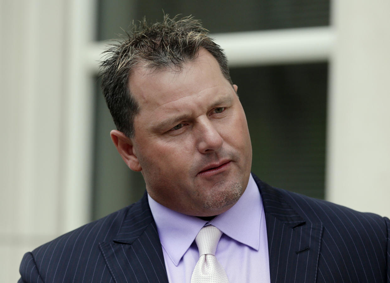 FILE - Former baseball player Roger Clemens leaves federal court in New York, Tuesday, April 29, 2014. Barry Bonds, Roger Clemens and David Ortiz appear to be the only players with a chance at Hall of Fame enshrinement when results are unveiled Tuesday, Jan. 25, 2022, with Ortiz most likely to get in on his first try. Bonds and Clemens are each in their 10th and final turns under consideration by voters from the Baseball Writers' Association of America. (AP Photo/Seth Wenig, File)