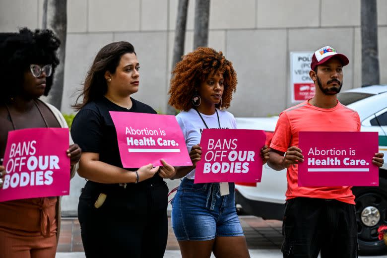 Members of Florida Planned Parenthood PAC hold placards in Miami as they protest the U.S. Supreme Court ruling that overturned the landmark abortion case Roe v. Wade. (Chandan Khanna/AFP via Getty Images)