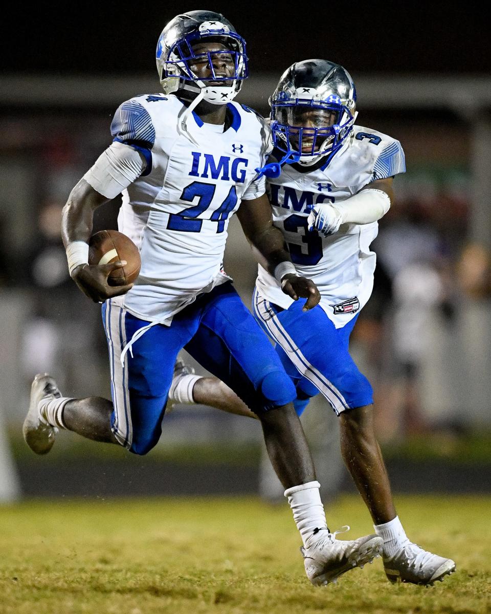 IMG Academy's Kamari Wilson (24) celebrates an interception. Wilson is ranked No. 4 on the USA Today top 100 and will announce his decision at 4 p.m. on Wednesday.