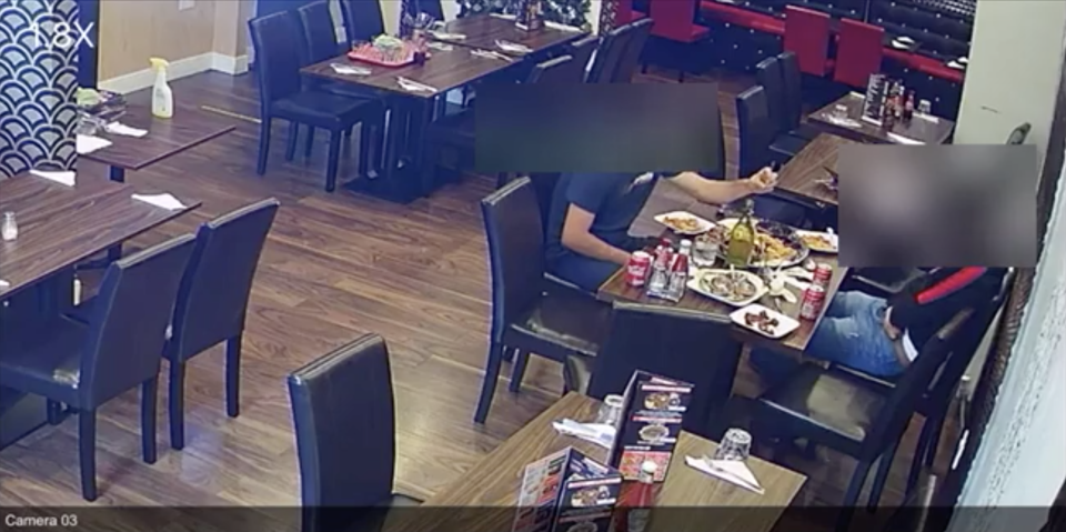 CCTV footage appears to show a man sprinkling something on his food.