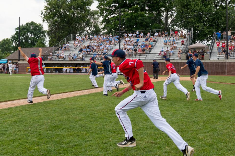 The Tecumseh Braves charge the field in celebration after beating the Shakamak Lakers in the 2022 Class A semi-state game at Alvin C. Ruxer Field in Jasper, Ind., Saturday, June 11, 2022. 