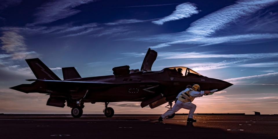 F-35 Lightning fighter jets conduct their first night flying trials off the warship - Royal Navy/Kyle Heller 